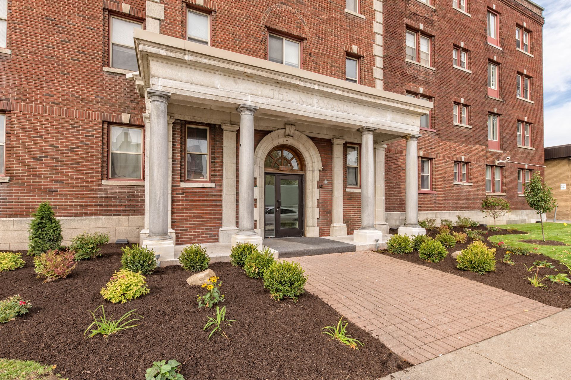 Normandie Apartments front door and landscaping