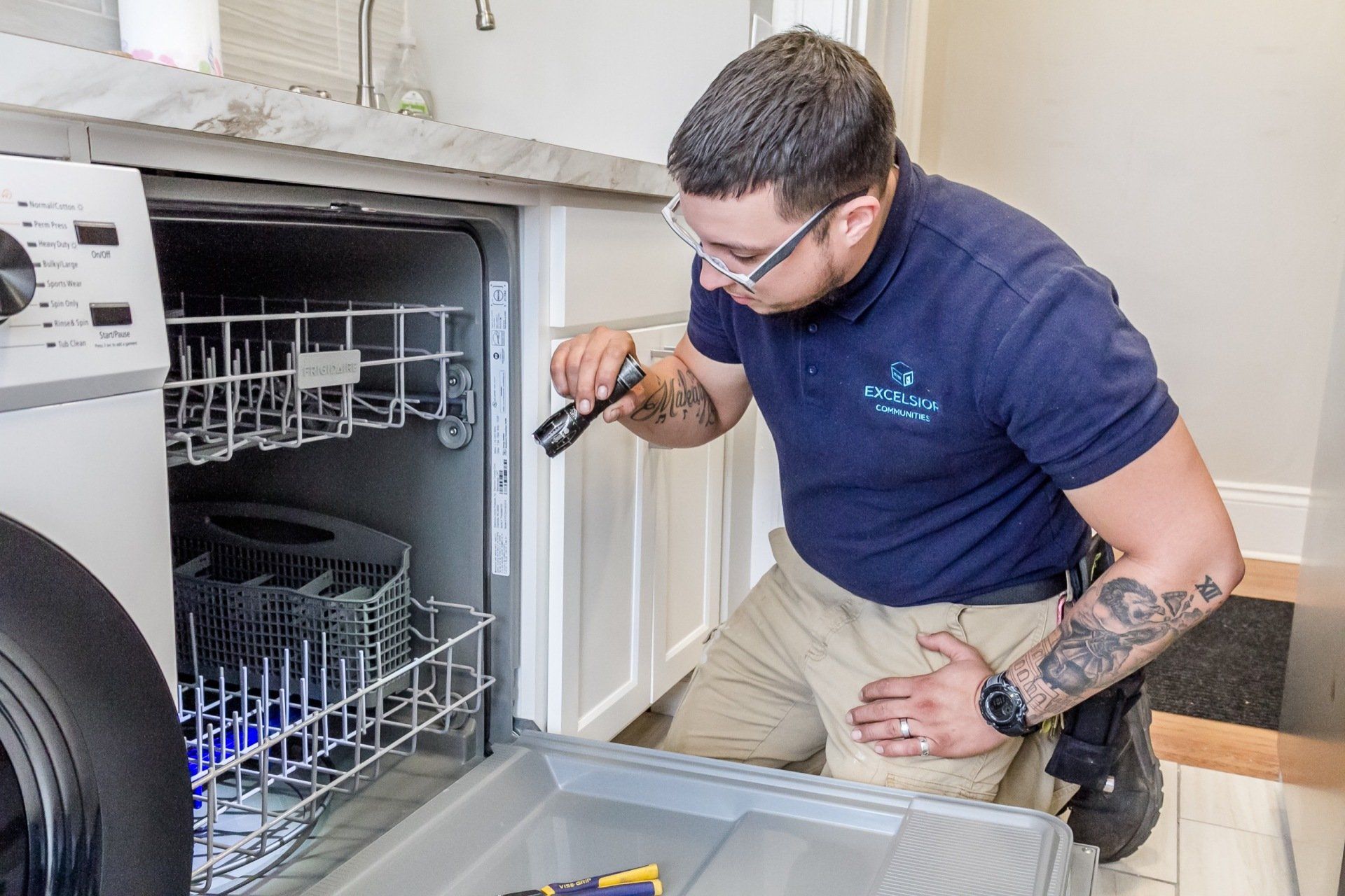 Guy looking at dishwasher
