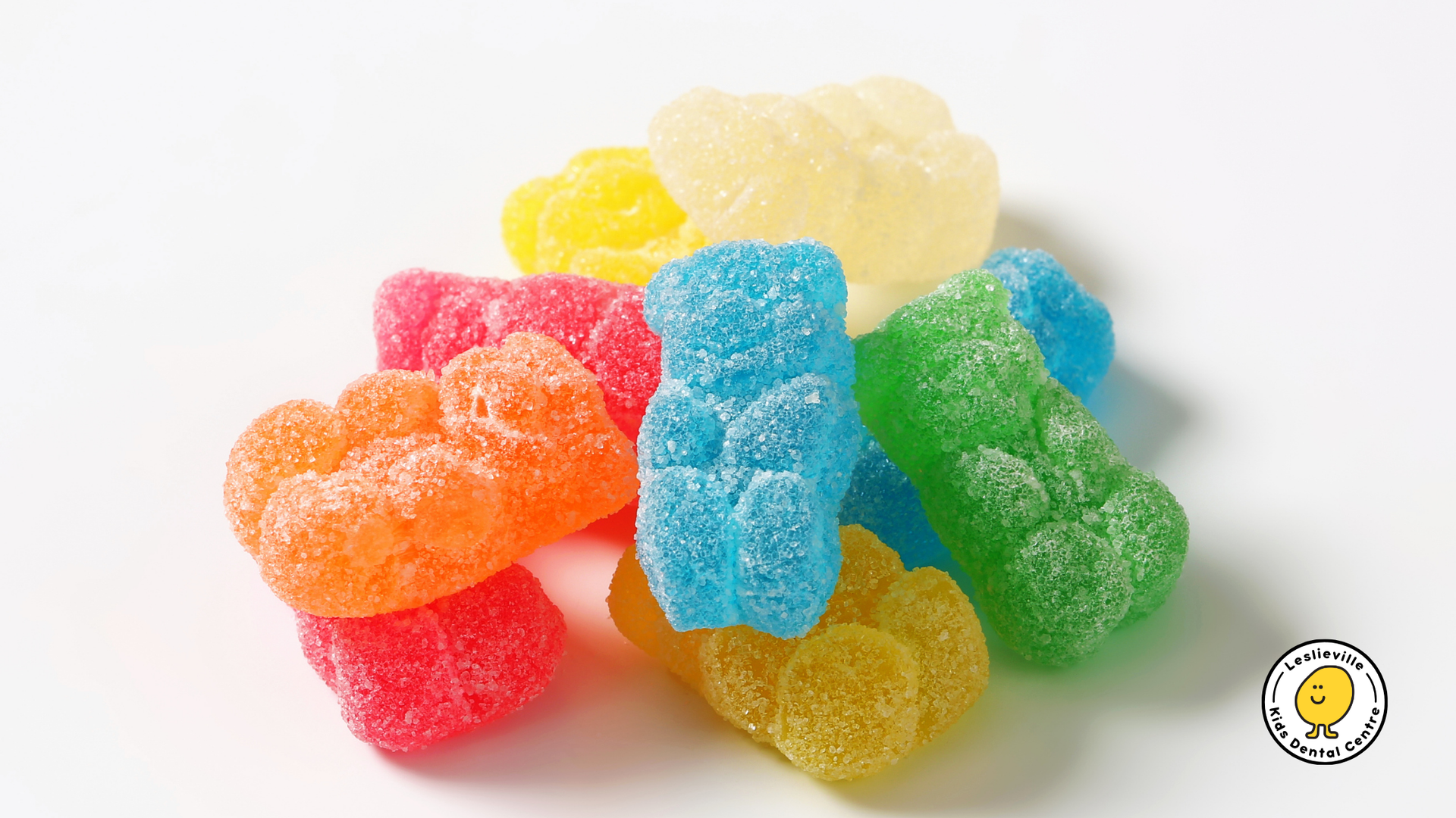 Pile of colorful, sugar-coated gummy bears in various colors, including red, orange, yellow, blue, and green.