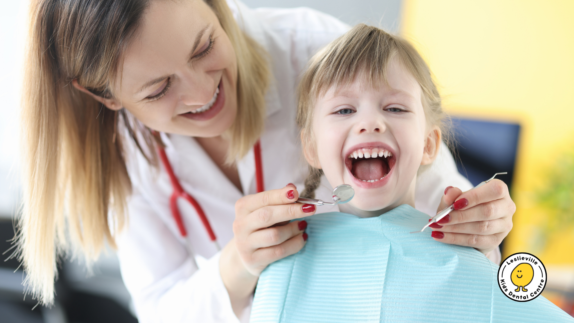 A dentist is examining a little girl 's teeth in a dental office.