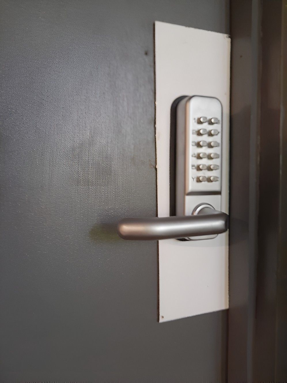 A Close Up Of A Door With A Keypad On It — Cassowary Coast Locksmiths In East Feluga, QLD