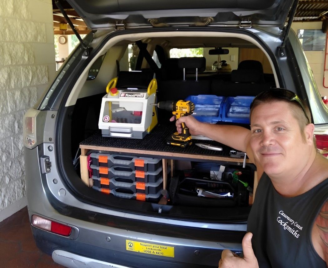 A Man Giving A Thumbs Up In Front Of A Car — Cassowary Coast Locksmiths In East Feluga, QLD
