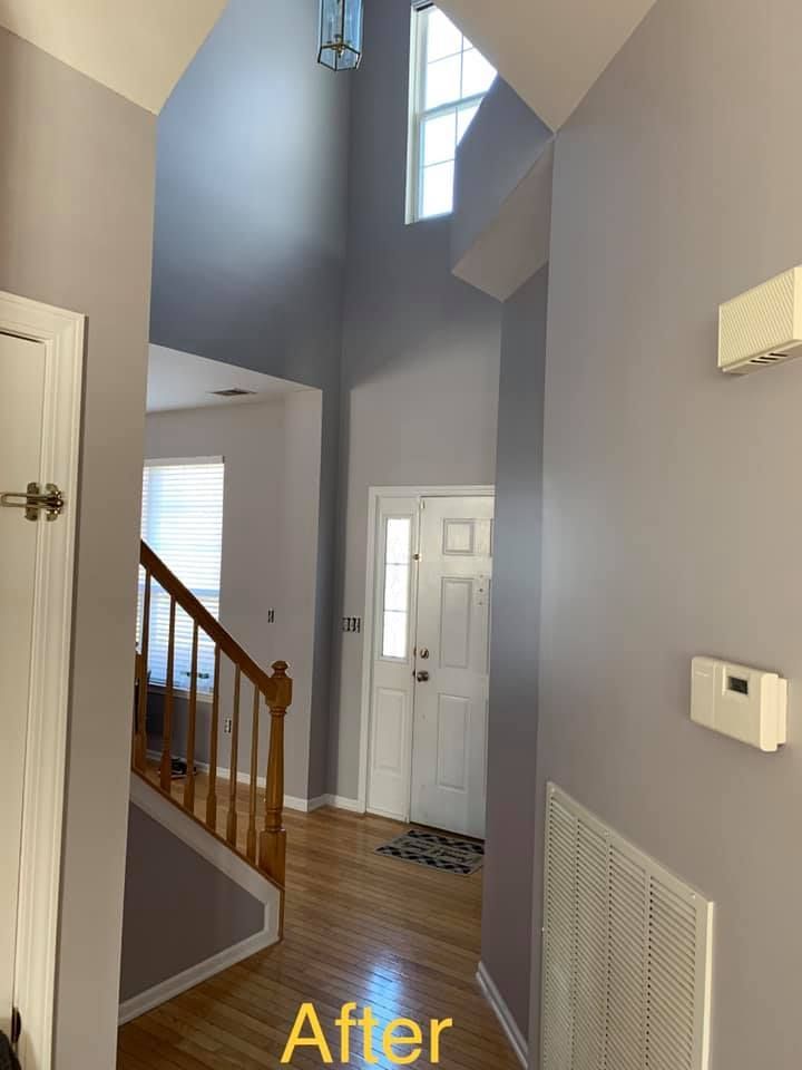 A picture of a hallway in a house after being painted.