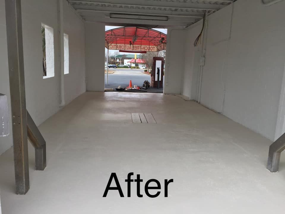 A picture of a car wash after being painted white