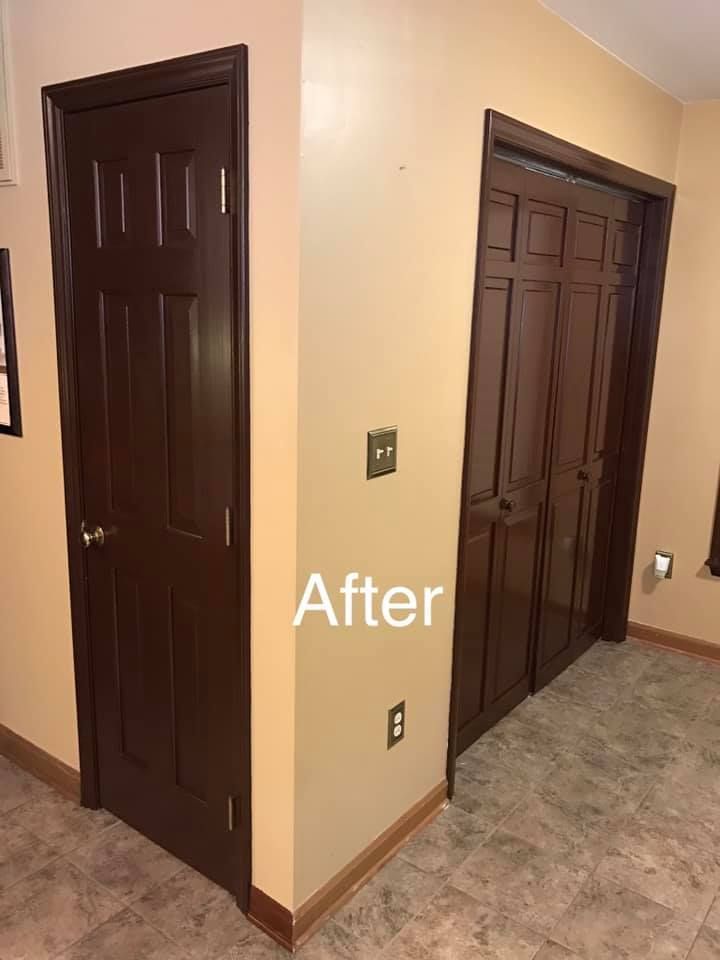 A room with two brown doors and a tile floor.