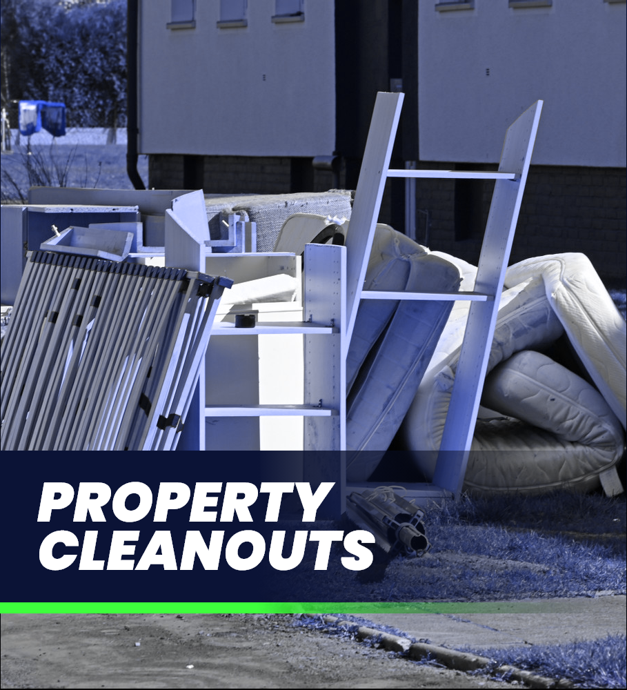 a pile of property cleanouts sits on the side of the road