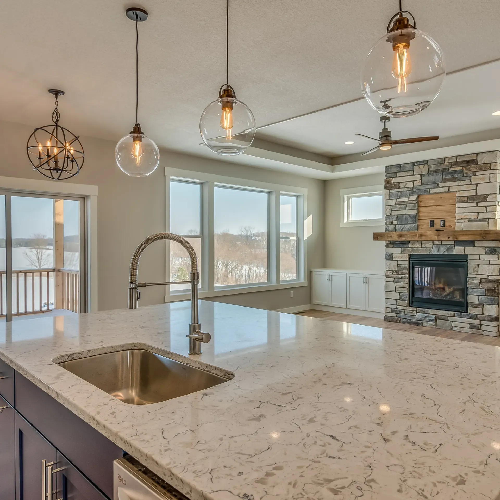 Horizon Electric USA - A kitchen with a sink and a fireplace in the background