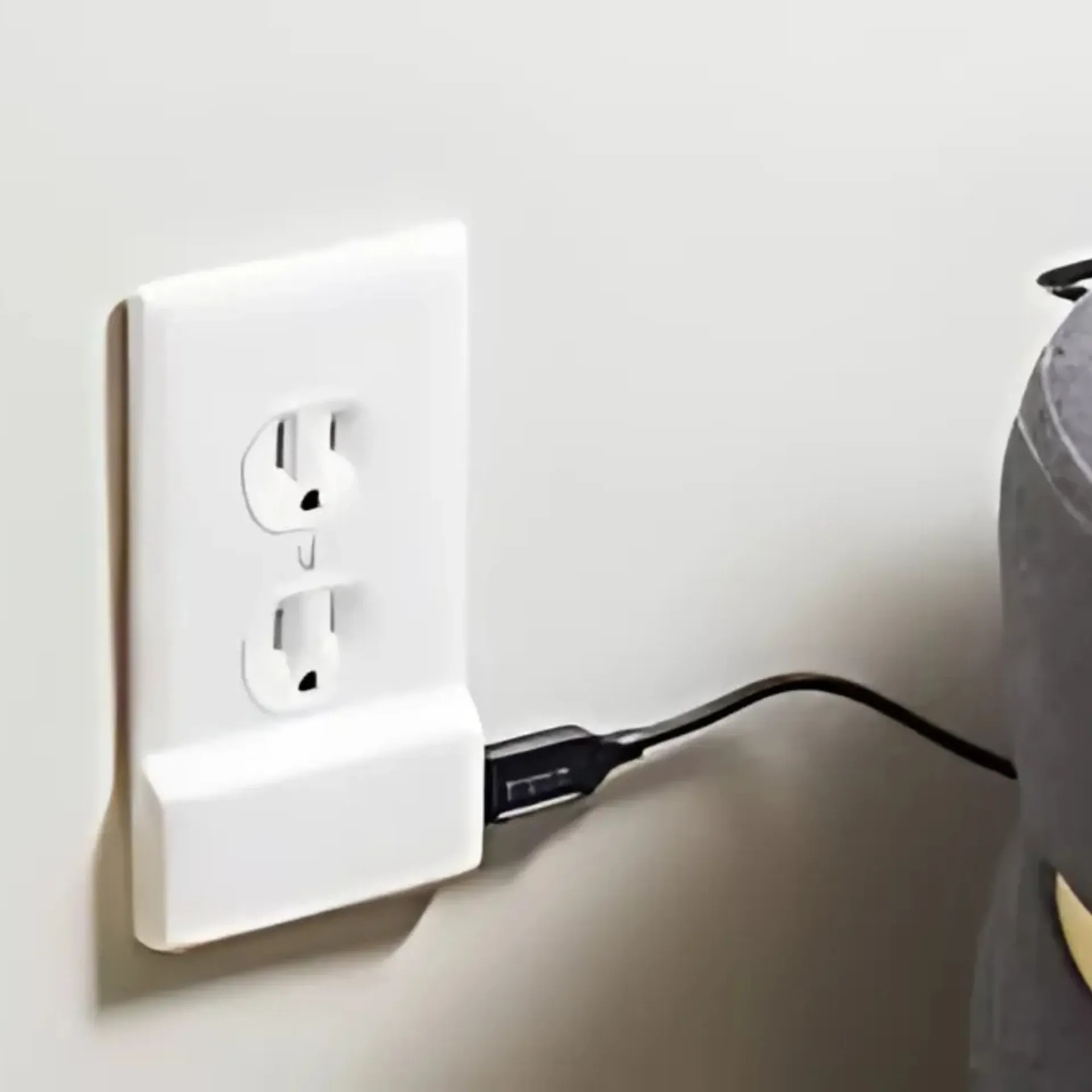 Horizon Electric USA - A white electrical outlet with a cord plugged into it
