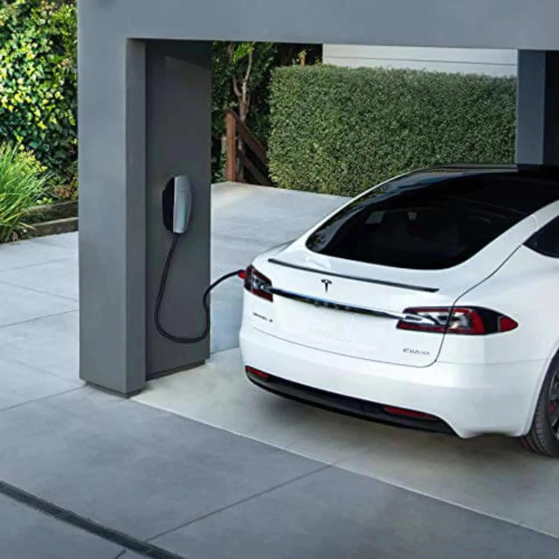 Horizon Electric USA - A white tesla model s is being charged at a charging station.