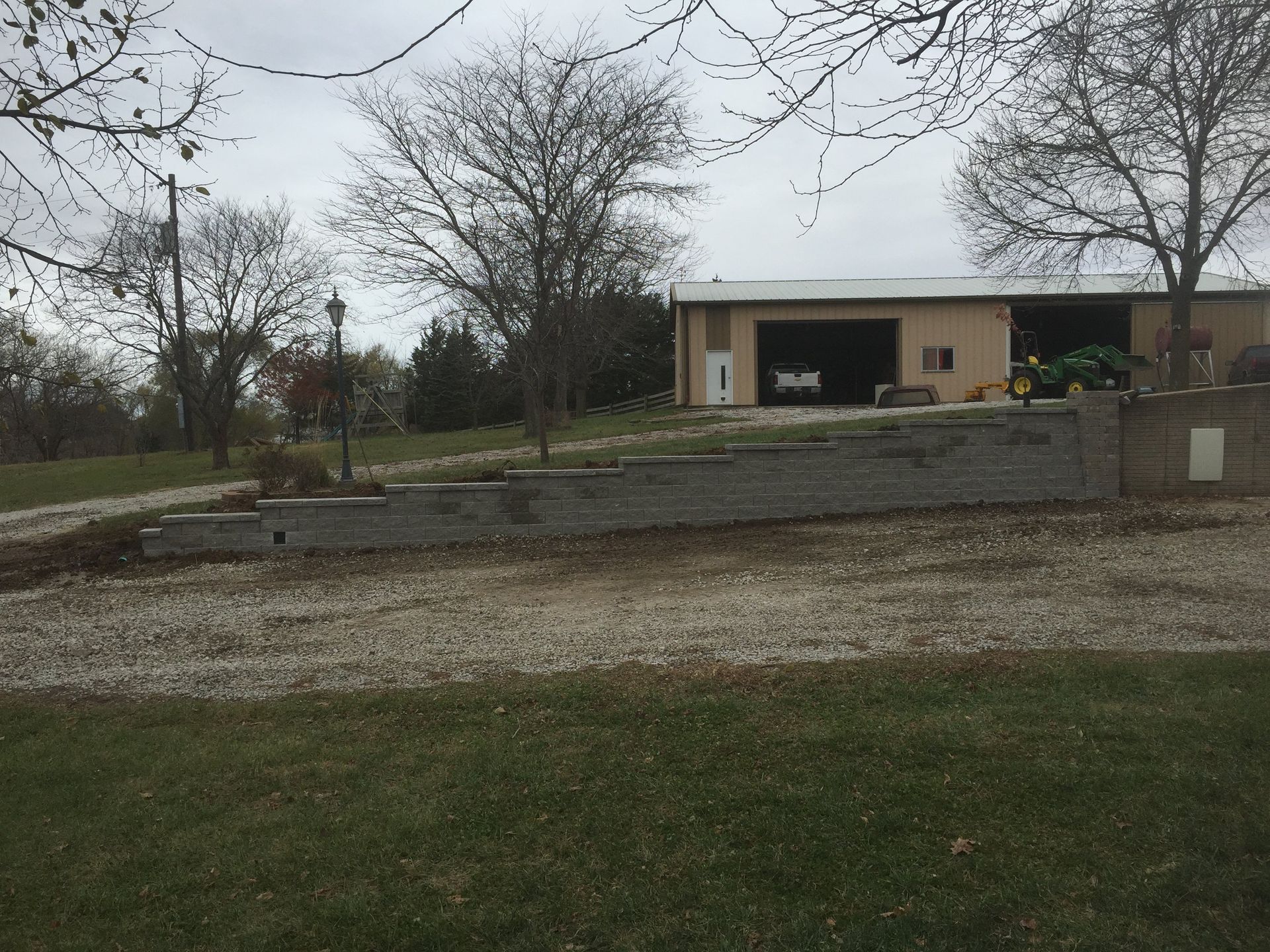 A house with a tractor parked in front of it