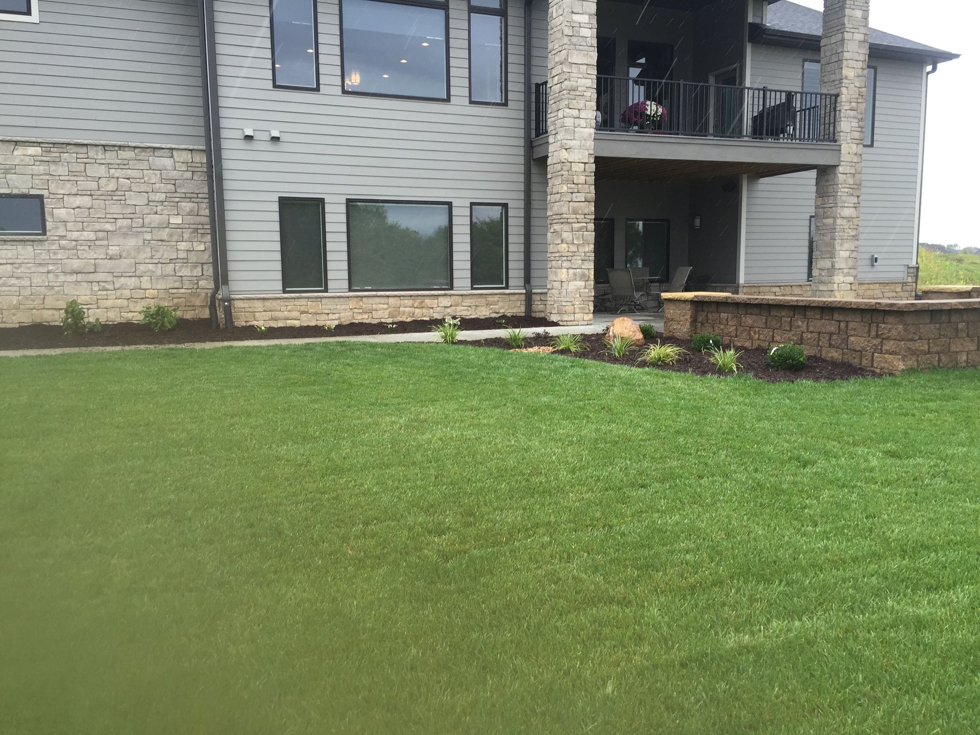 A large house with a large lawn in front of it.