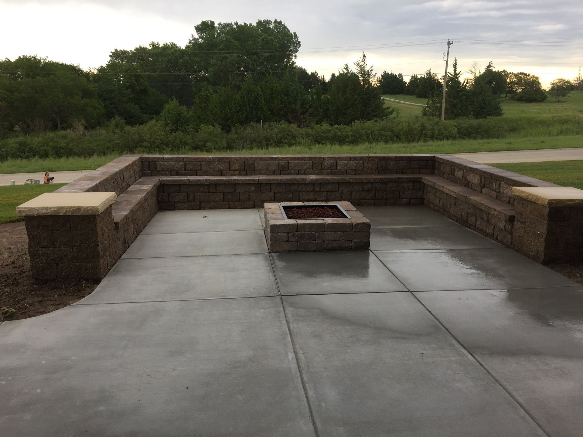 There is a fire pit in the middle of the patio.