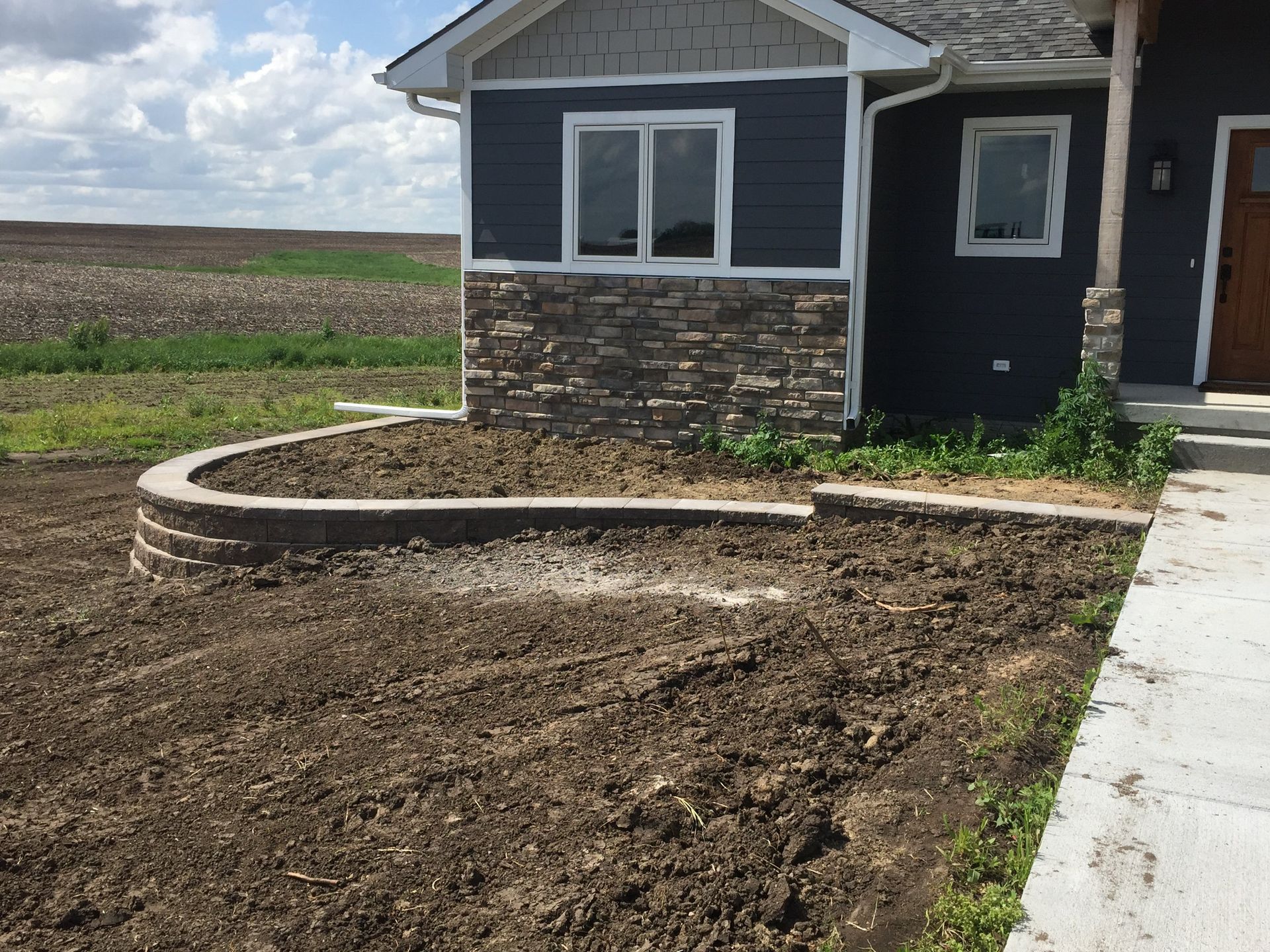A house with a lot of dirt in front of it