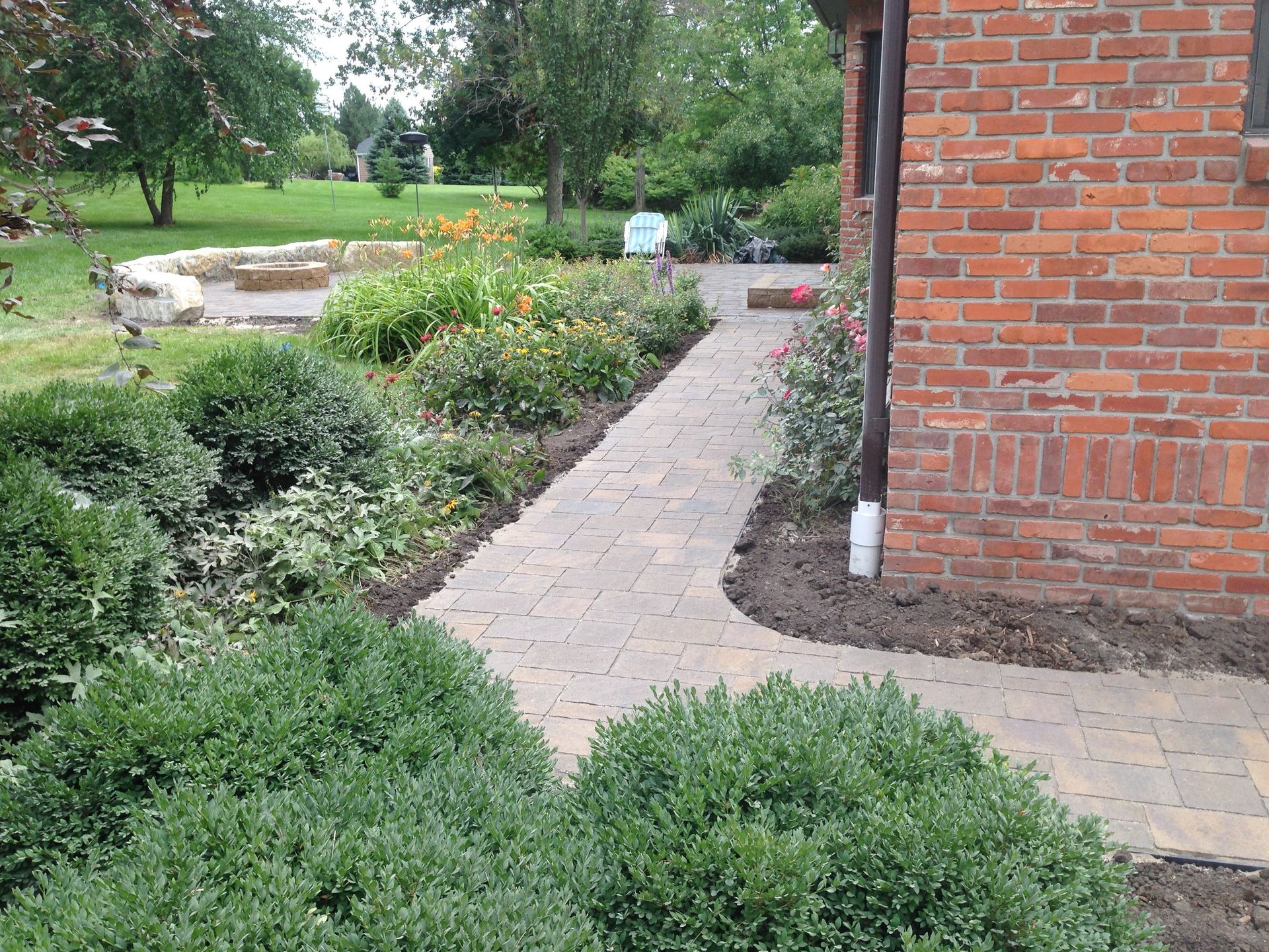 A brick building with a walkway leading to it