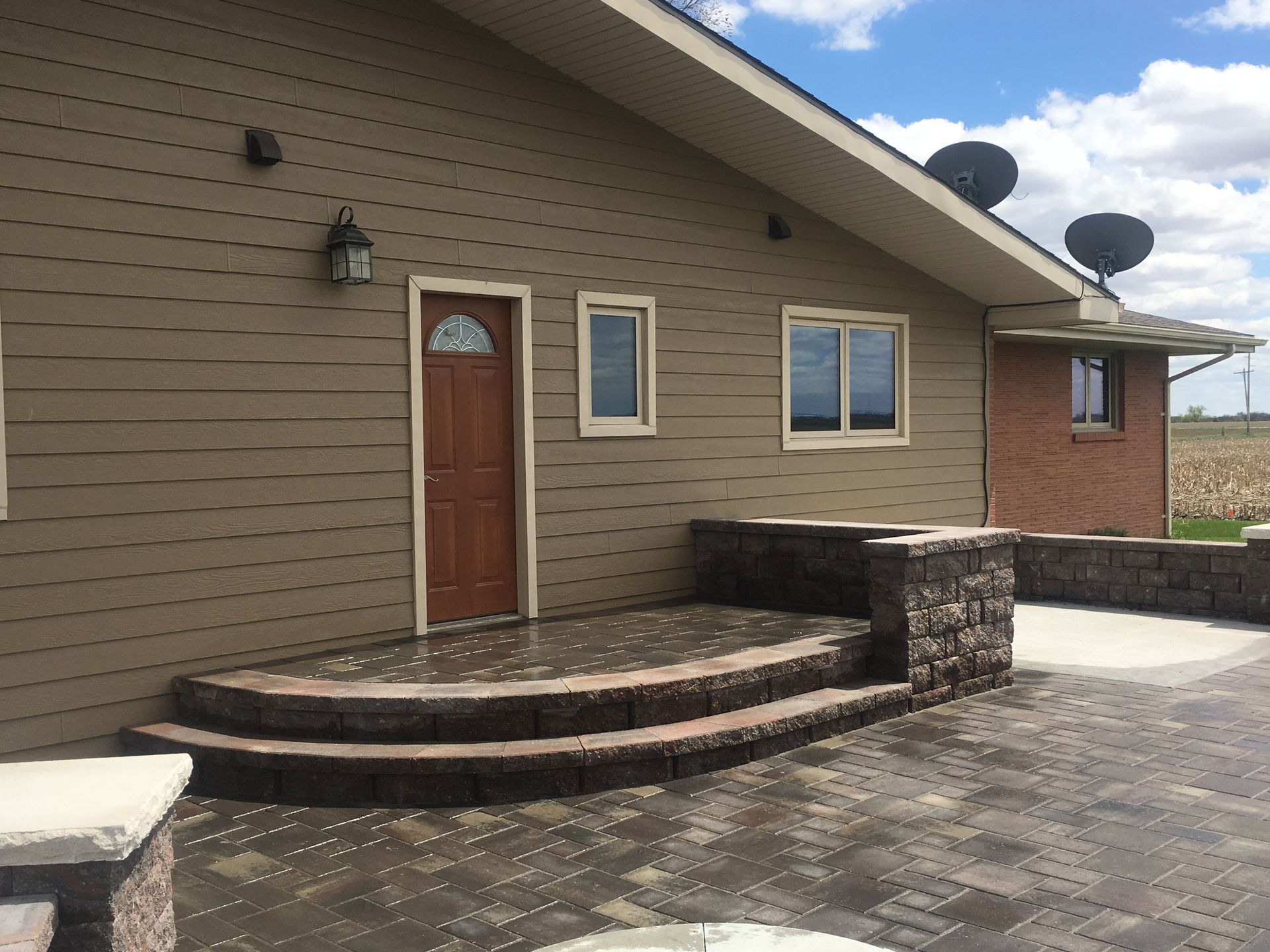 A house with stairs leading up to the front door