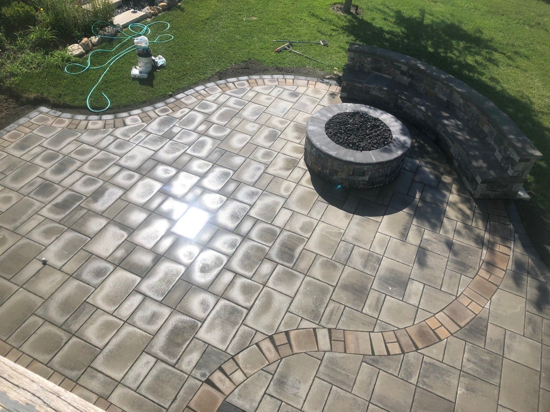 There is a fire pit in the middle of the patio.