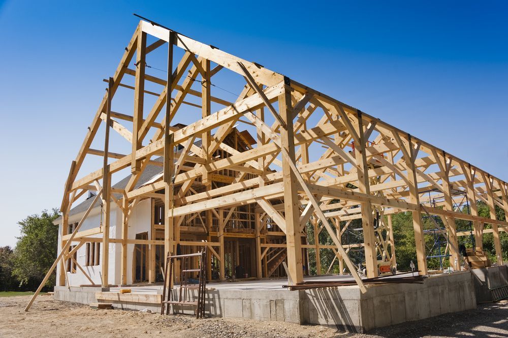 Wooden House Frame Under Construction on a Sunny Site — C K Carpentry in Byron Bay, NSW
