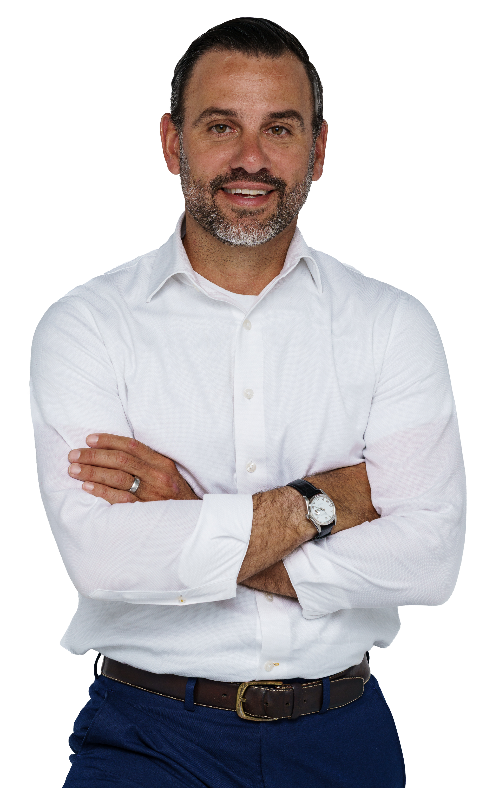 A man in a suit and tie is standing in front of a white background.