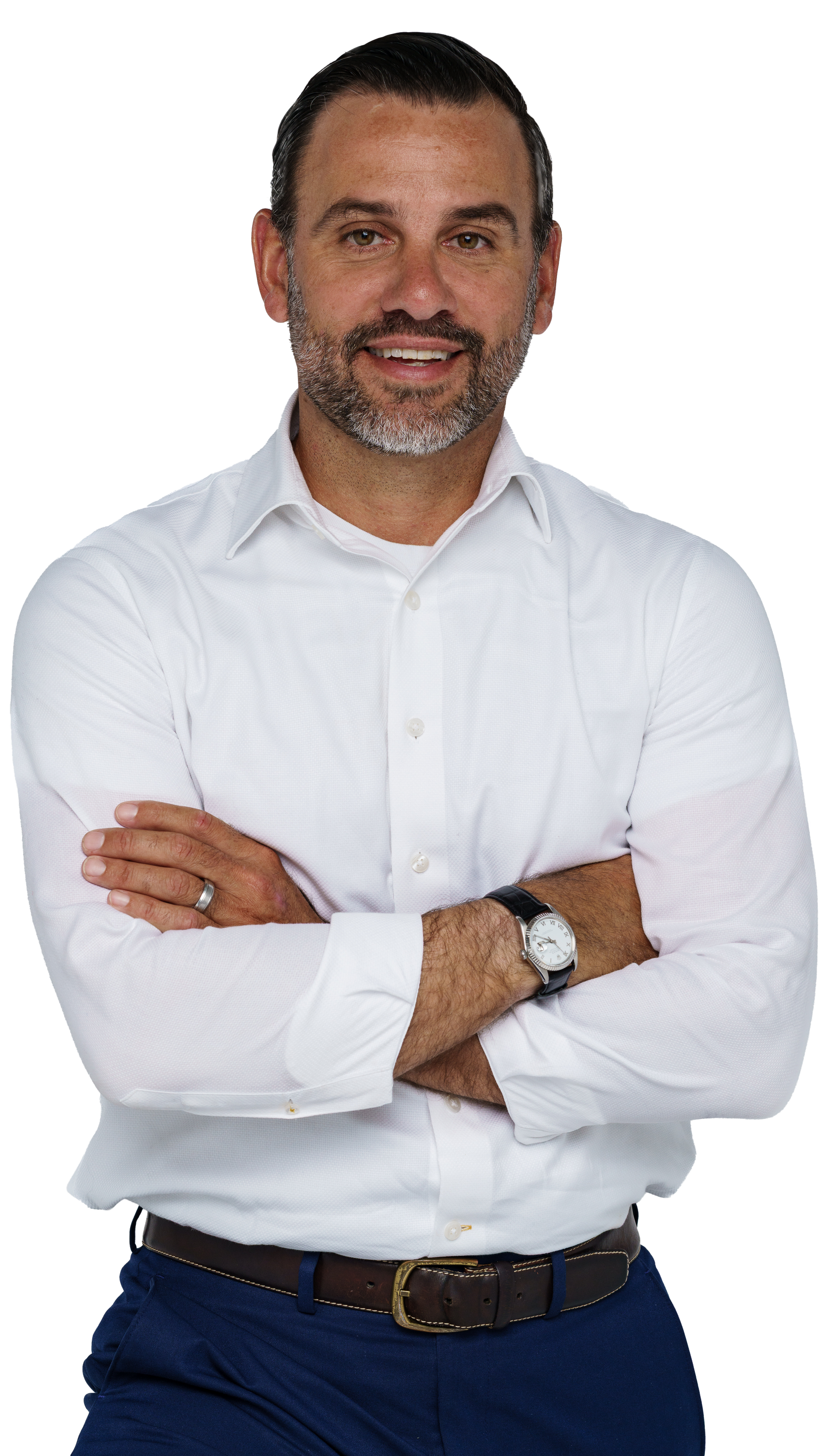 A man in a suit and tie is standing in front of a white background.