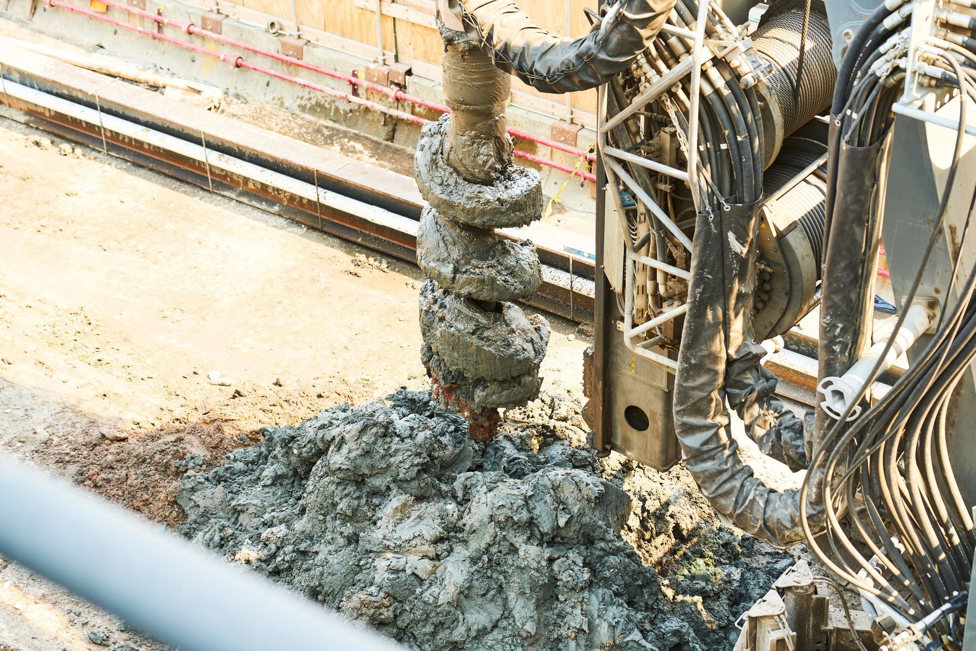 A machine is digging a hole in the ground.