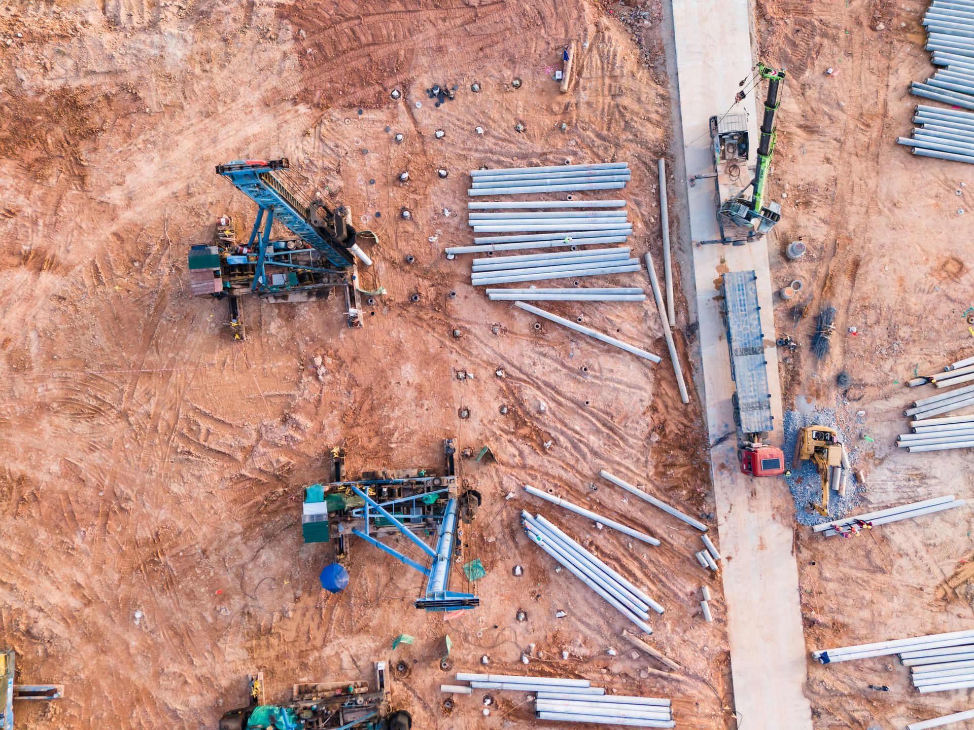 An aerial view of a construction site with a lot of machinery.