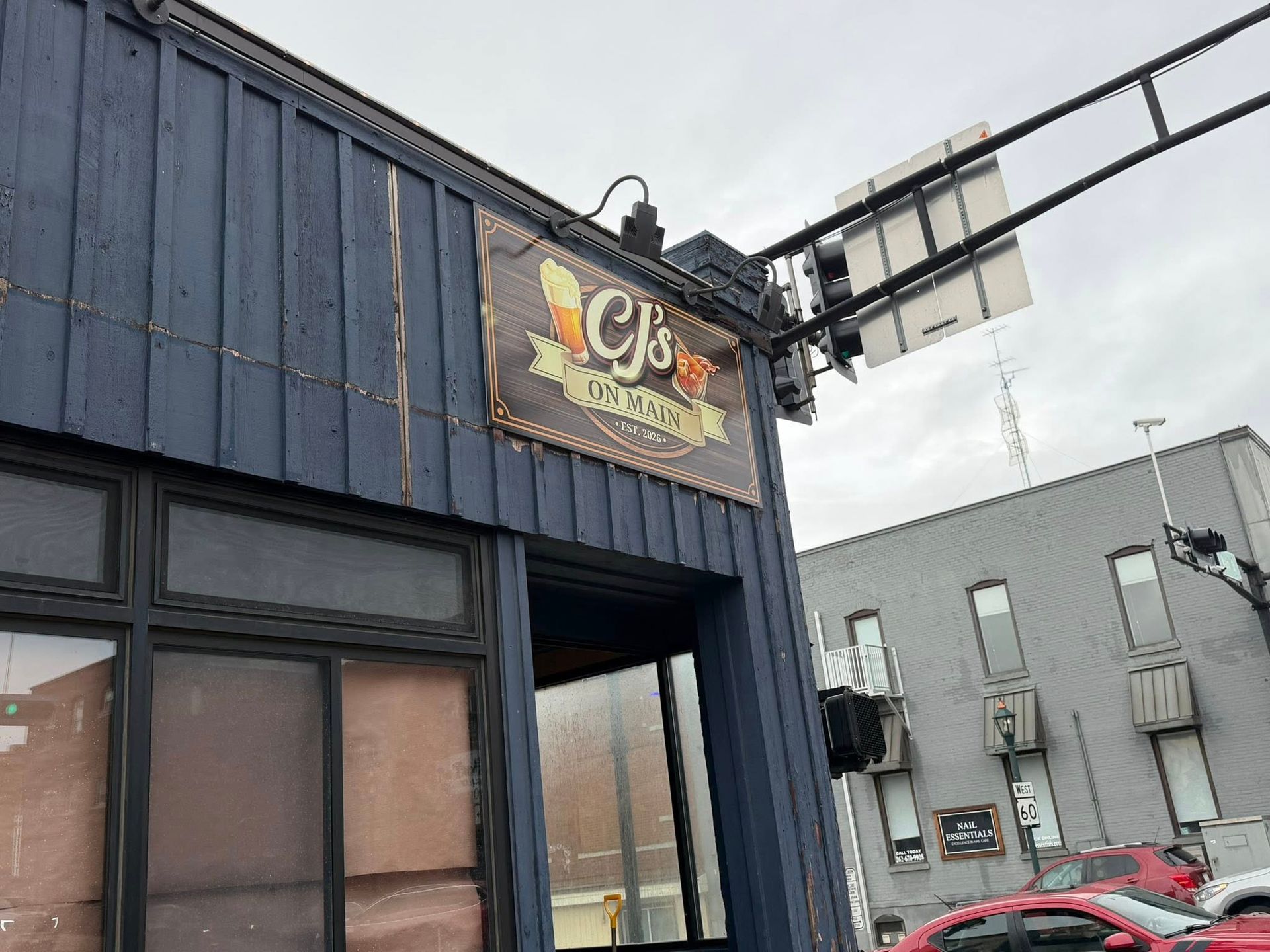 A blue building with a sign that reads 
