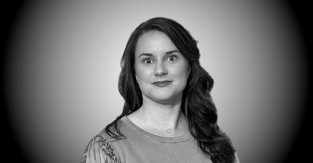 A black and white photo of a woman with long hair