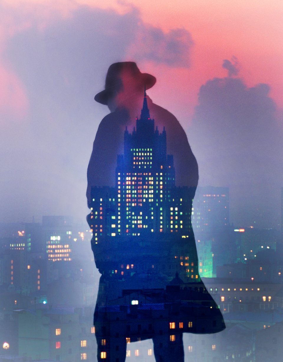 Shadow of a man in front of skyscraper
