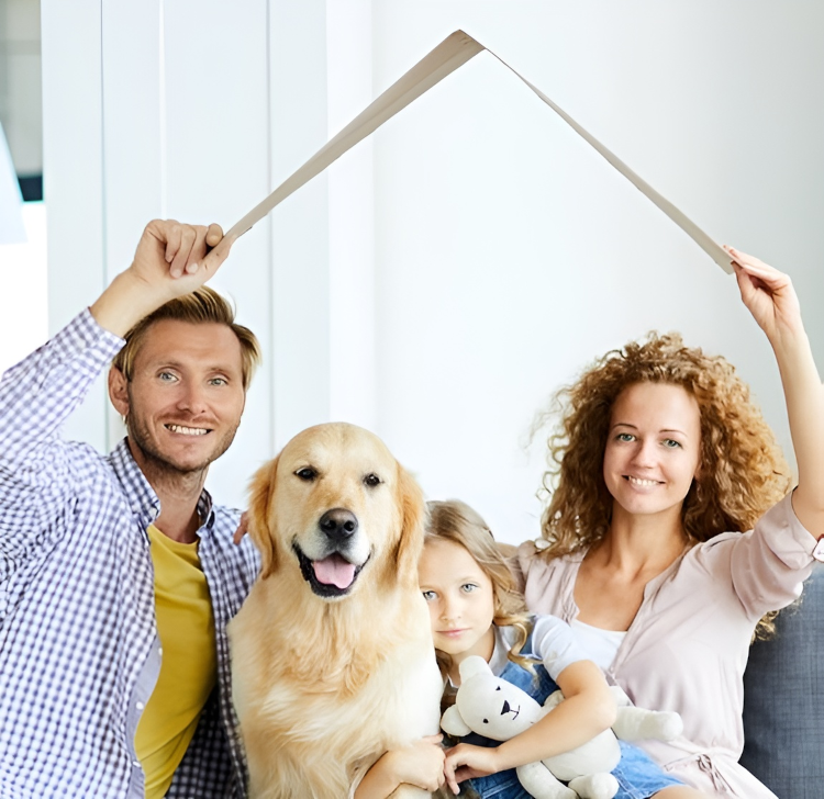 A family with a dog holding a piece of paper over their head