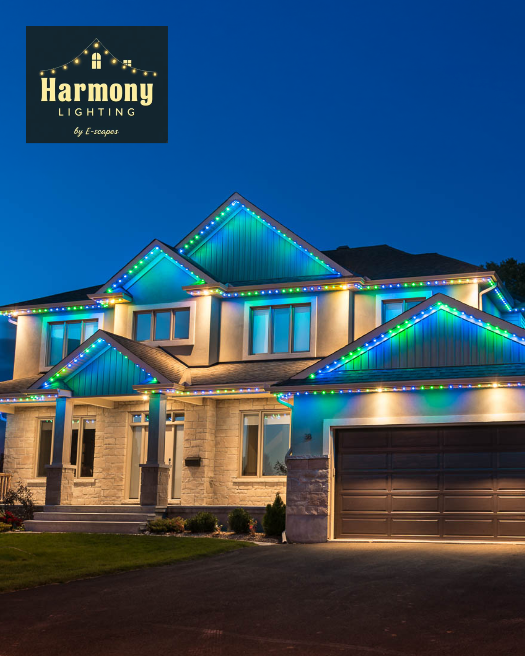 Two-story house with roofline Christmas lights in blue and green. Harmony Lighting logo in the top left corner.