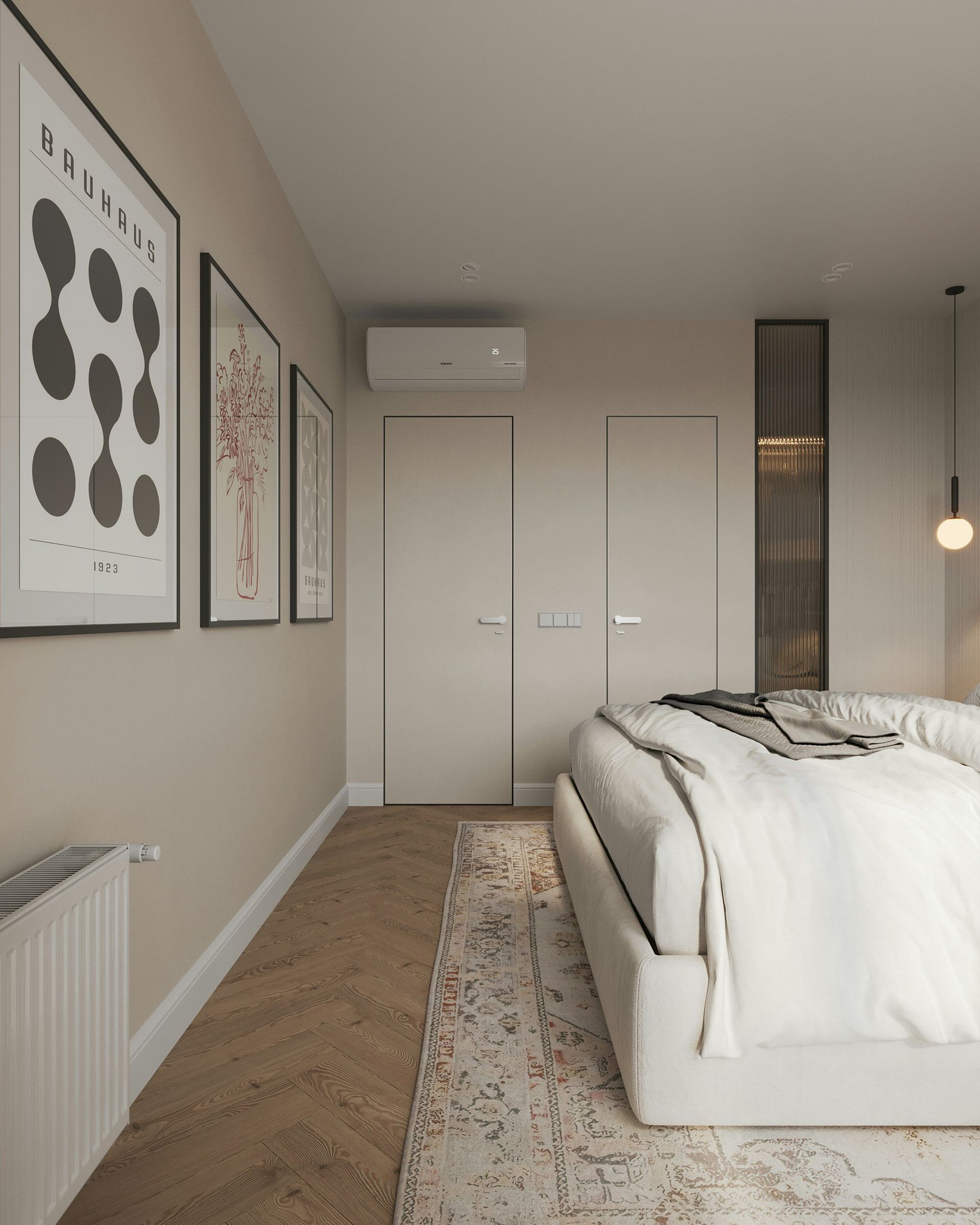 Bedroom with art prints, bed, white closet doors, and rug on carpet.