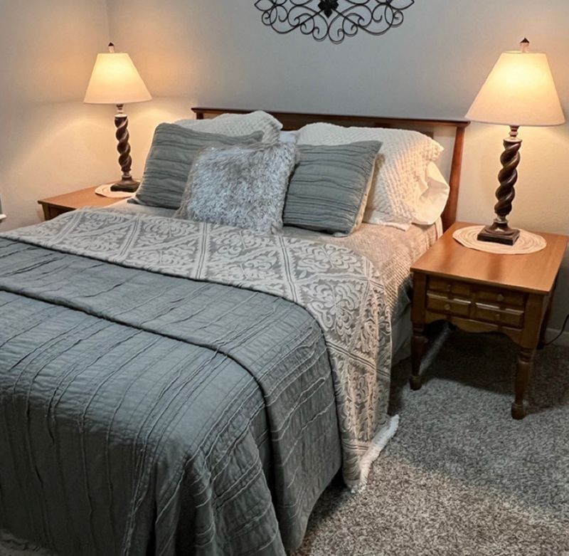 bed with gray comforter