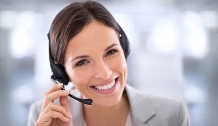 Smiling lady wearing a telephone headset