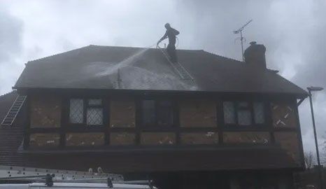 Power hosing roof tiles