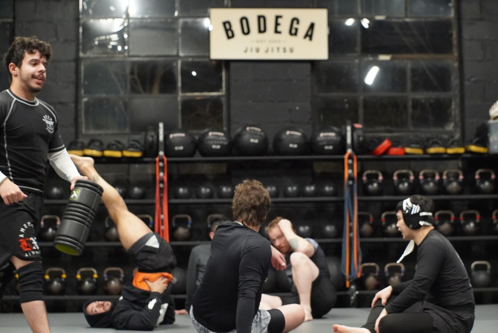 Beginners drill low-impact grappling at Bodega Jiu-Jitsu in Maplewood, NJ, building strength and mobility.