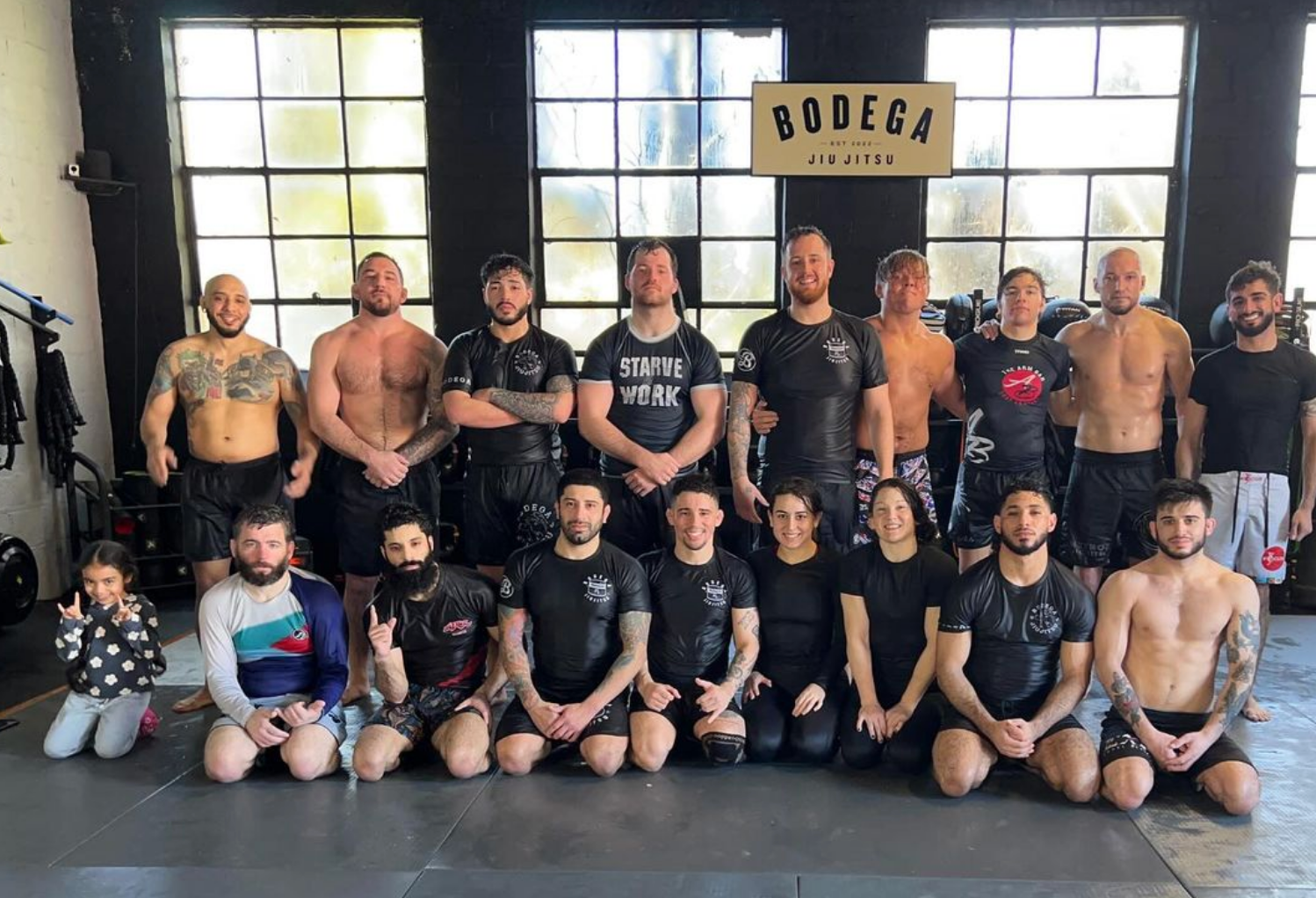 Adults practicing grappling drills at Bodega Jiu-Jitsu in Maplewood, NJ for stress relief and confidence.