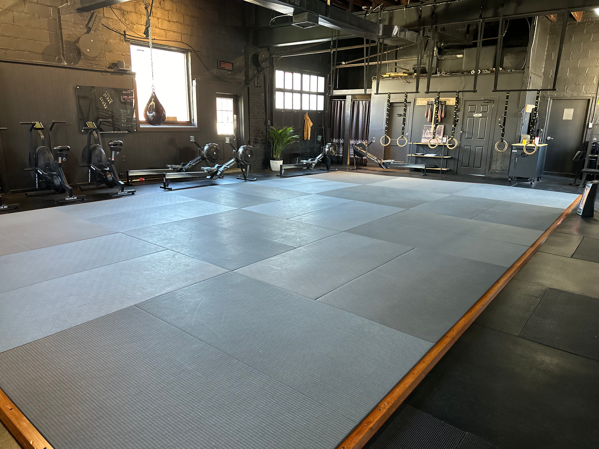 Adults practicing beginner No-Gi grappling at Bodega Jiu-Jitsu in Maplewood, NJ to build confidence.