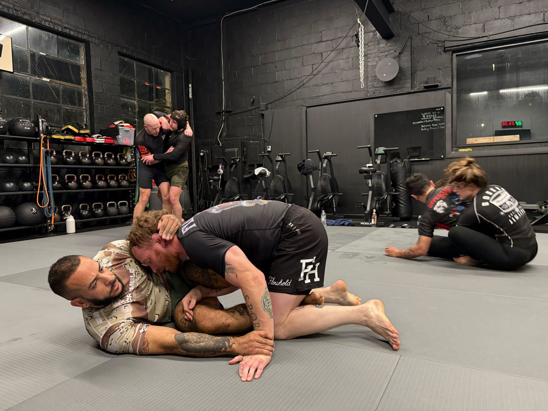 Adults practicing grappling fundamentals at Bodega Jiu-Jitsu in Maplewood, NJ.