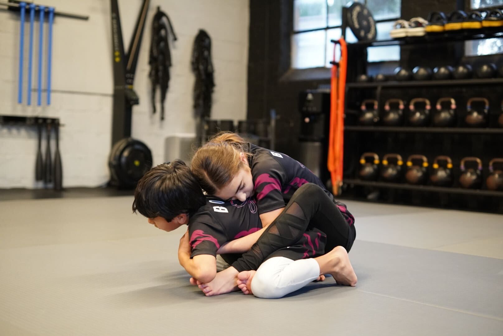Beginner learning basic Brazilian Jiu-Jitsu moves at Bodega Jiu-Jitsu in Maplewood NJ