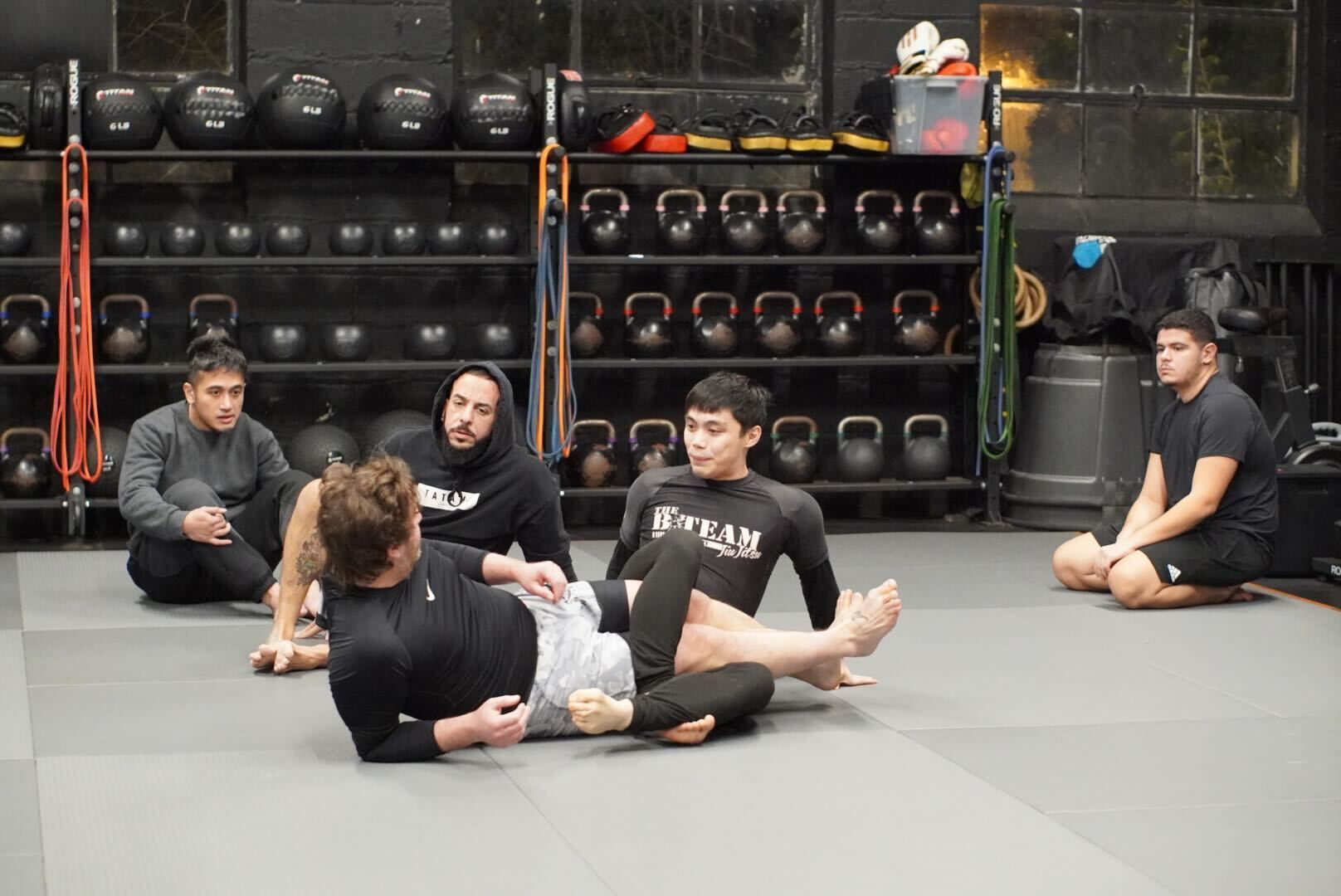 Student practicing Brazilian Jiu-Jitsu with calm focus during stress-control training