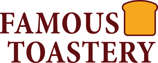 A logo for famous toastery with a slice of bread in the middle.