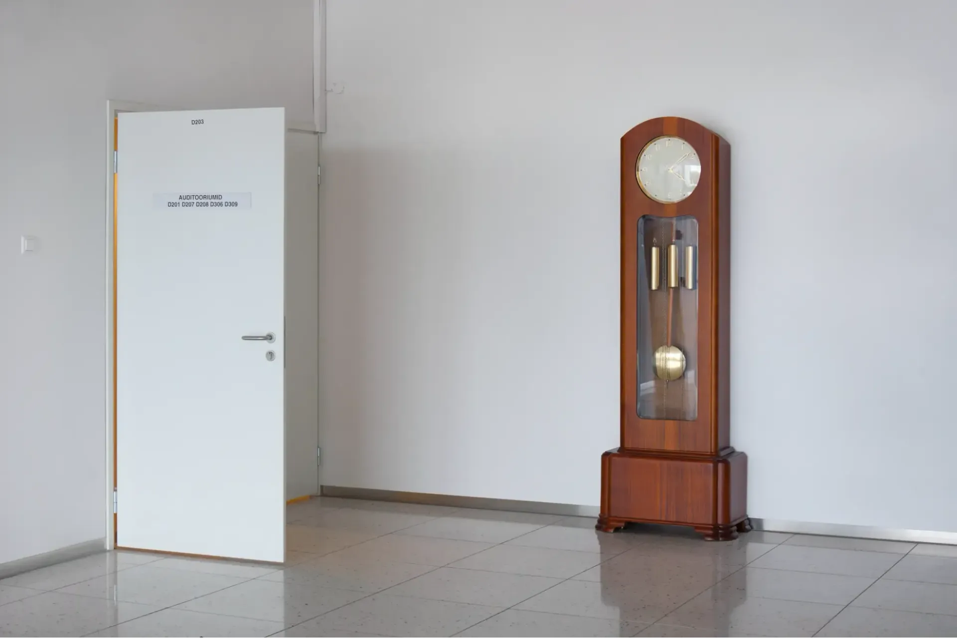 Grandfather clock in an empty room