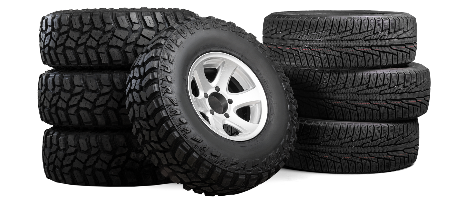 A stack of tires and wheels on a white background.