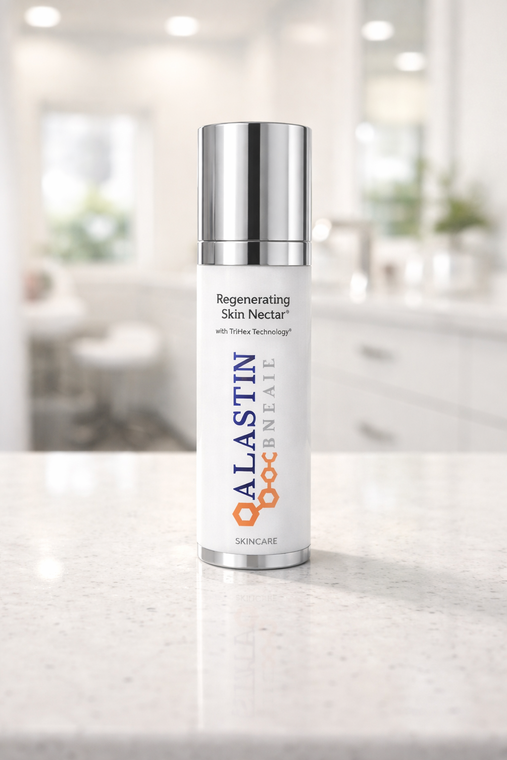 product photograph of a single bottle of Alastin Skincare Regenerating Skin Nectar sitting on a polished white quartz surface