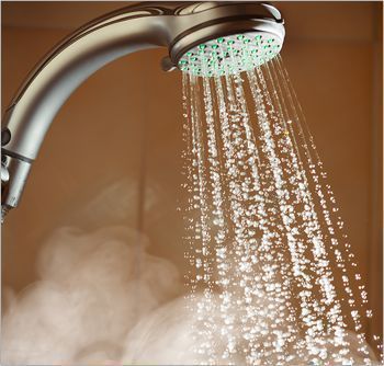 A Close Up of a Shower Head With Water Coming Out of It — FNQ Hot Water In Mareeba, QLD