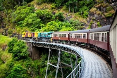 A Train is Going Over a Bridge in the Mountains — FNQ Hot Water In Cairns, QLD
