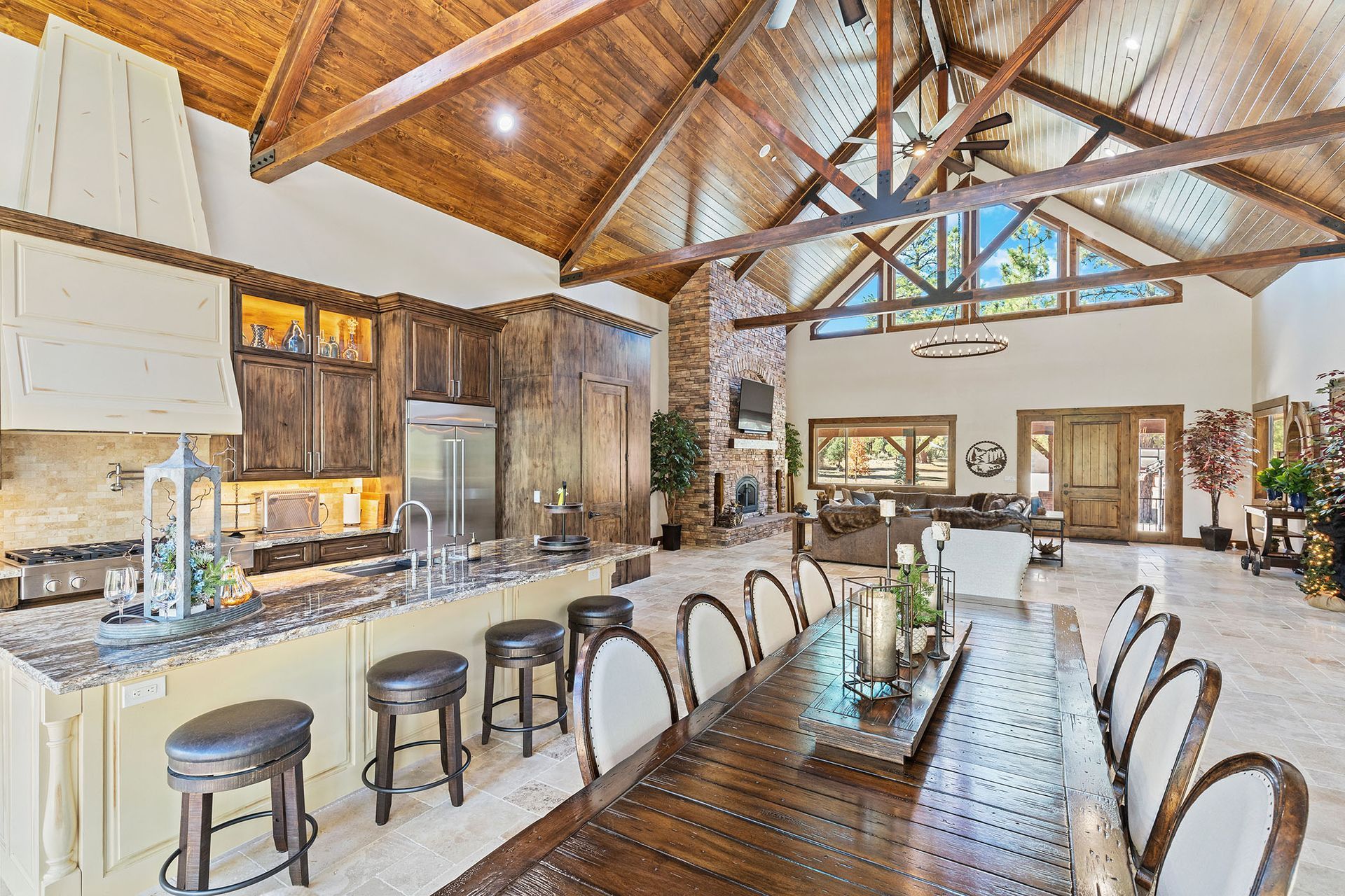 A large kitchen with a dining table and chairs in it.