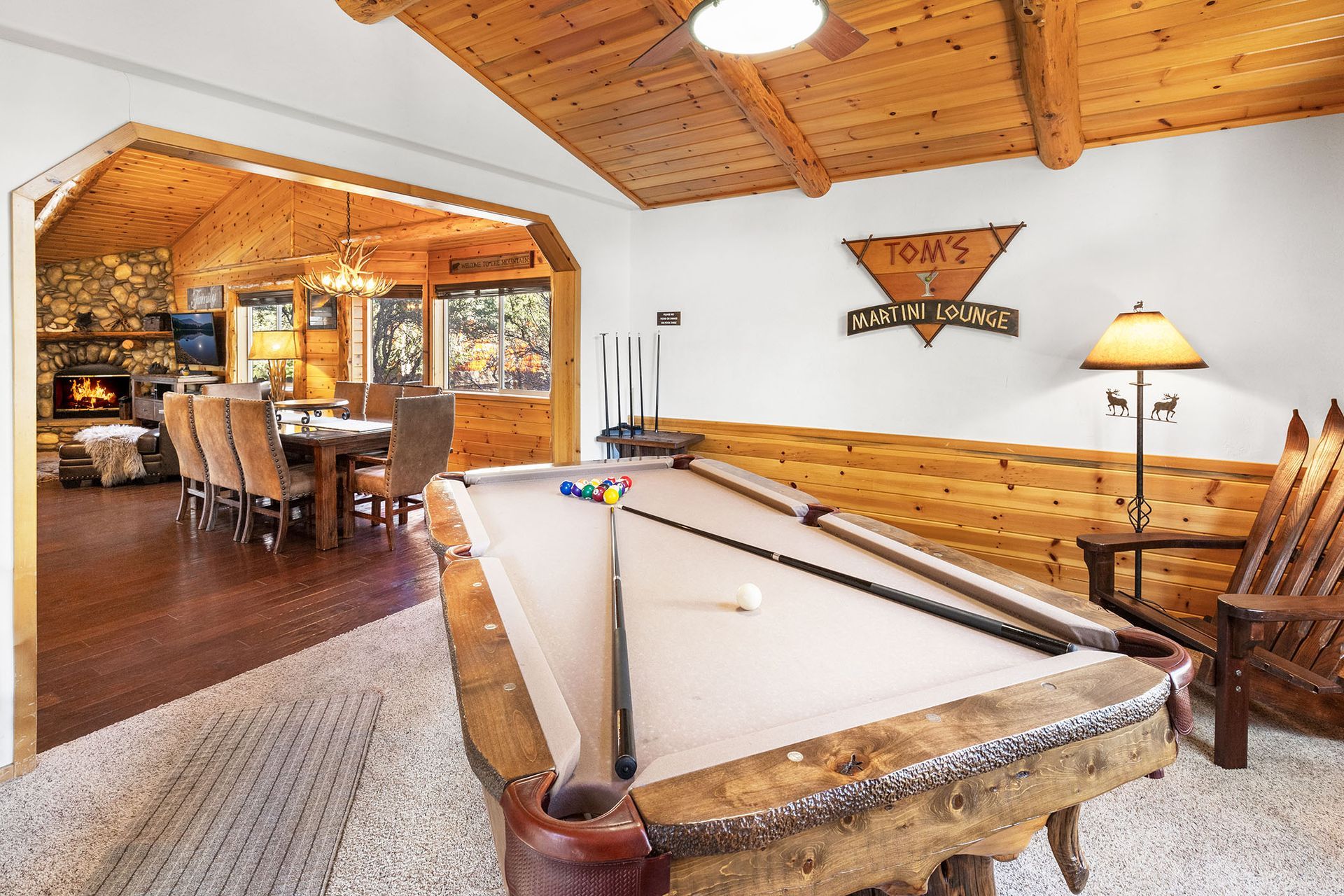 There is a pool table in the middle of the room.