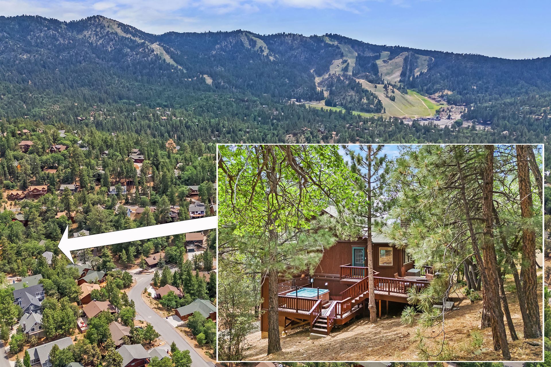 An aerial view of a cabin in the woods with mountains in the background.