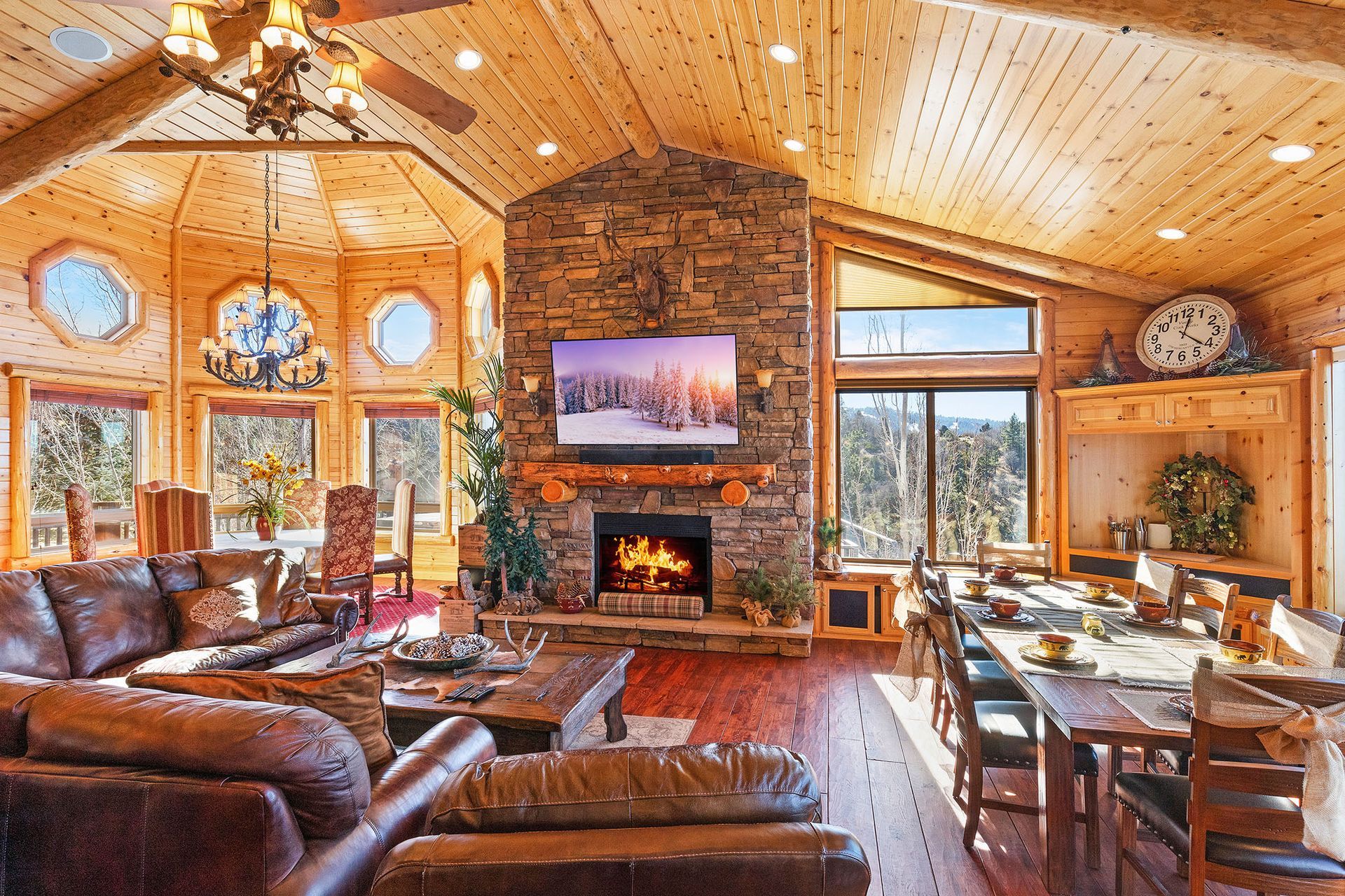 A living room with a fireplace and a flat screen tv